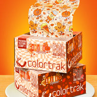 Stack of Colortrak foil boxes with Halloween-themed design on an orange background